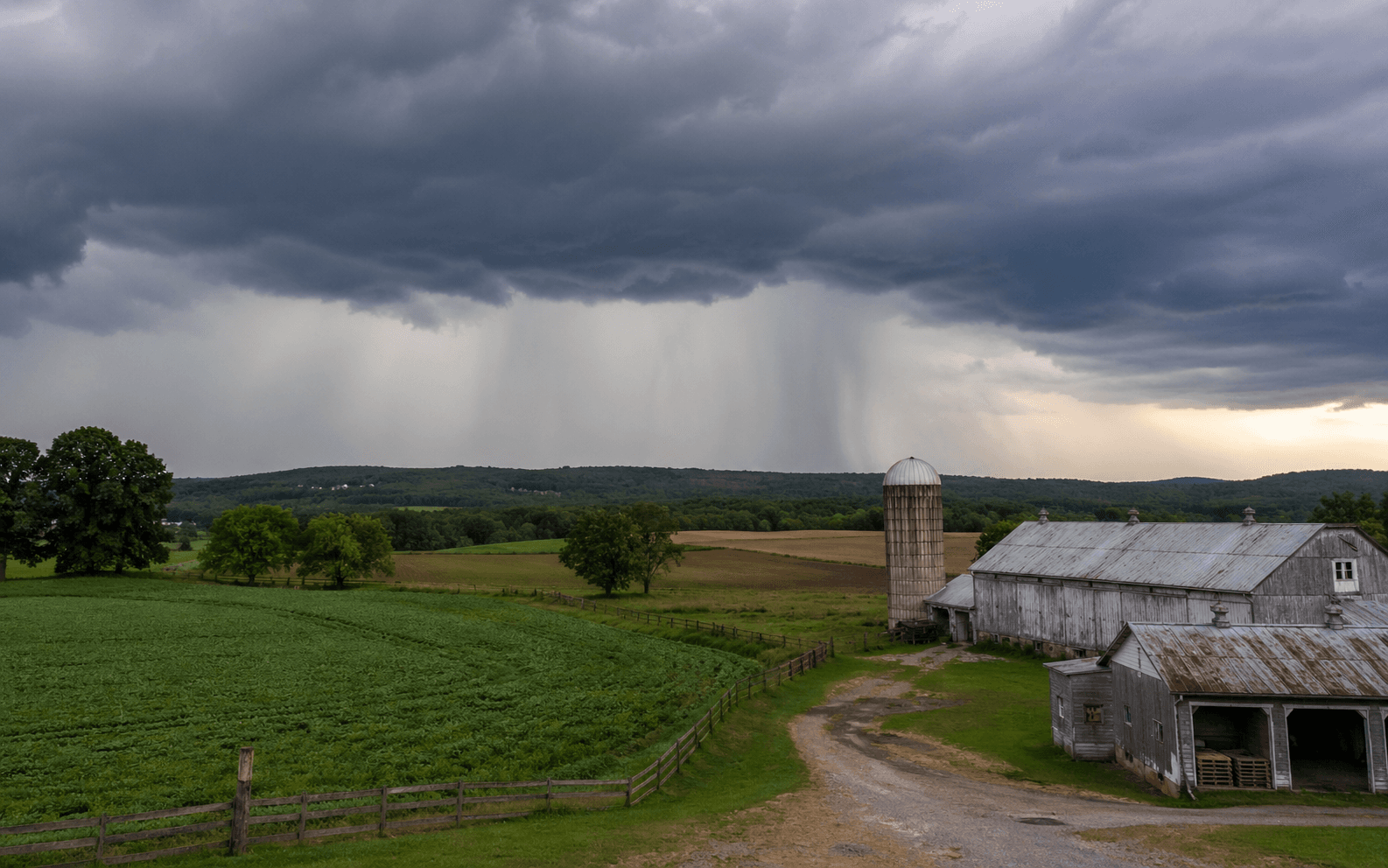 Weather rolling in over a working farm